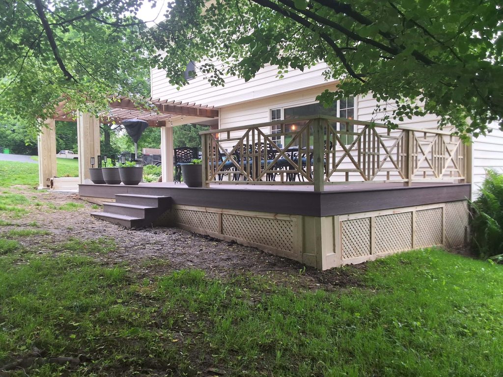 Another perspective of cedar-framed composite deck and pergola crafted by D Miller Exteriors Apple Creek OH